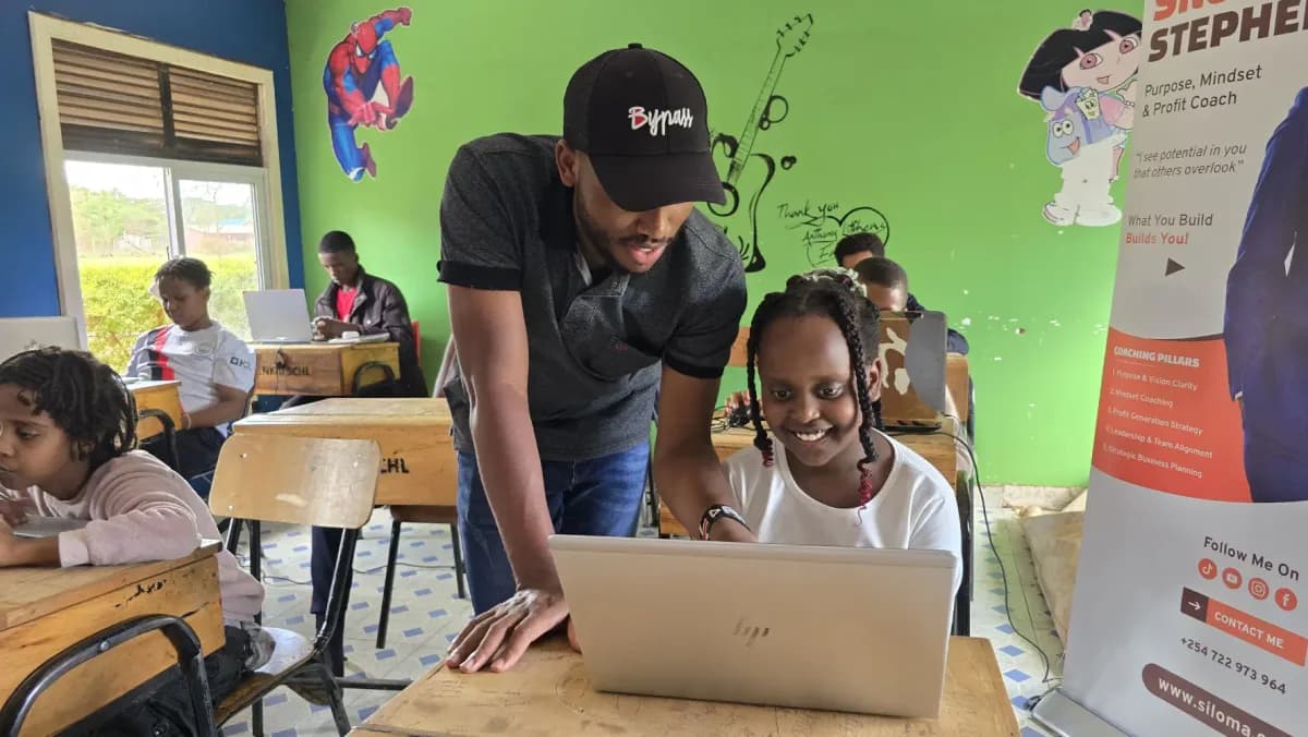 Daniel Njuguna teaching at the Kids AI Bootcamp